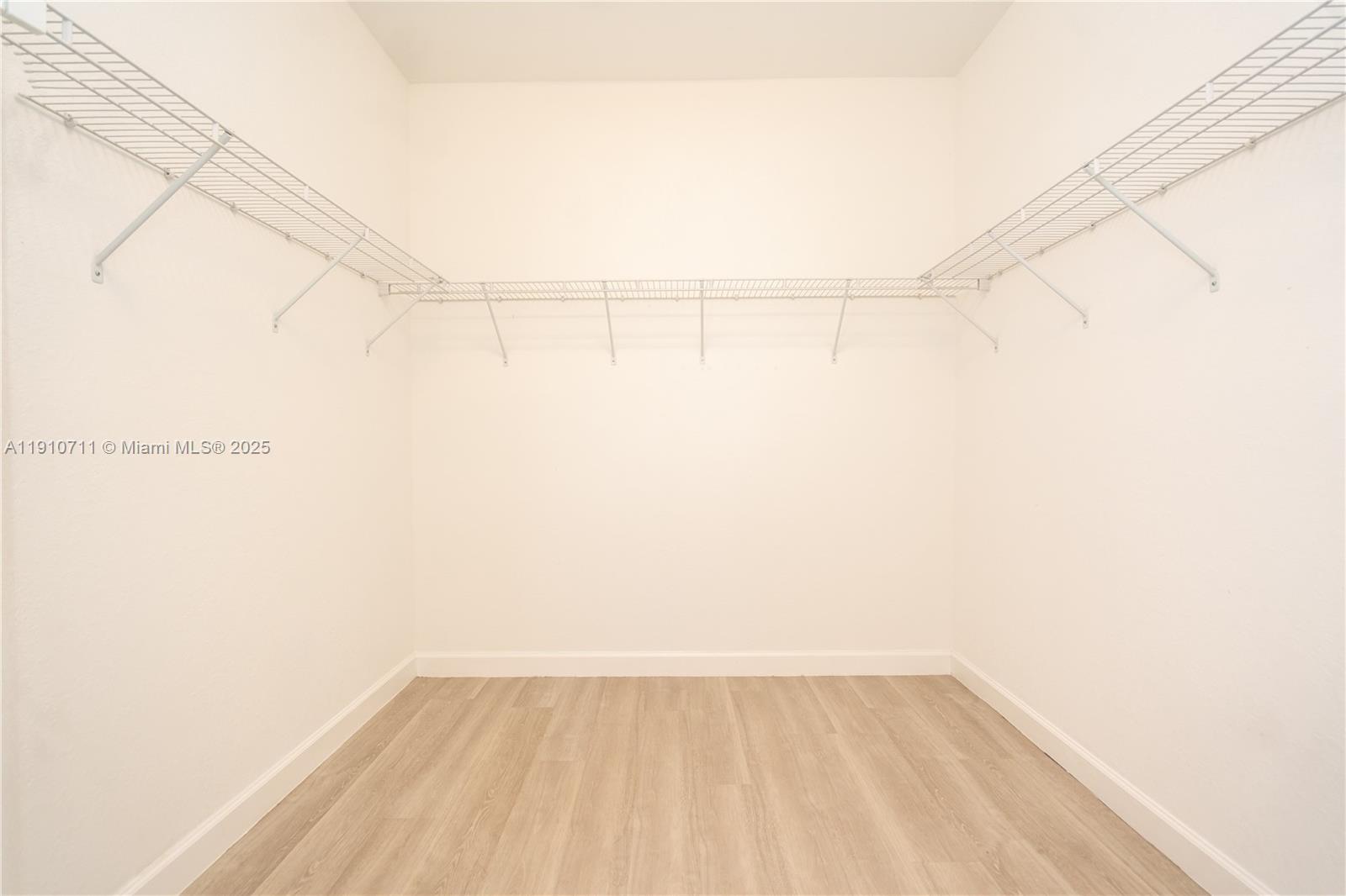 11374 Southwest 254th Terrace Homestead, FL 33032 - Photo 18 of 51 a view of a room with racks on the wall