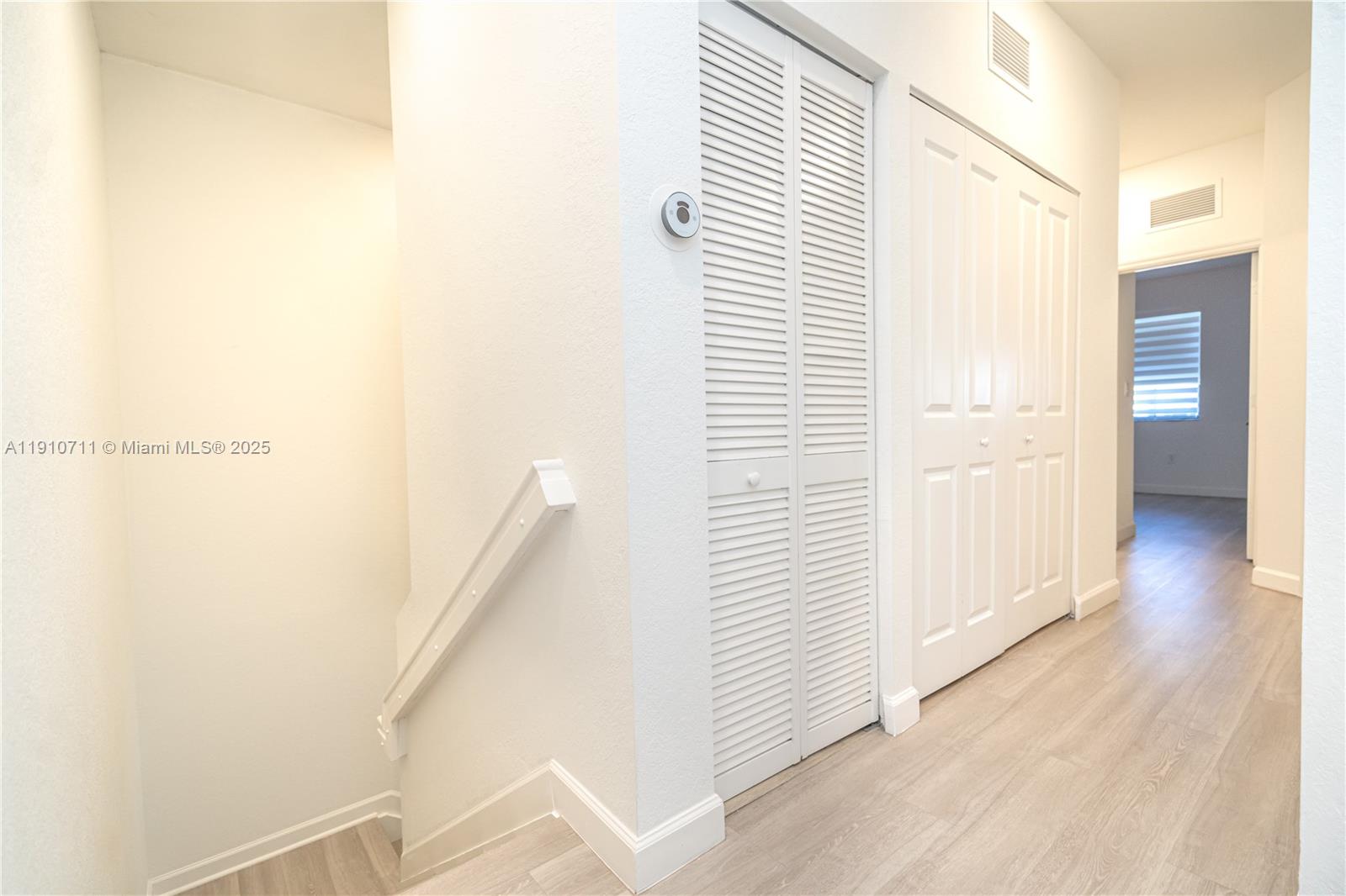 11374 Southwest 254th Terrace Homestead, FL 33032 - Photo 21 of 51 a view of a hallway with wooden floor and staircase