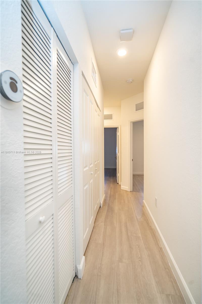 11374 Southwest 254th Terrace Homestead, FL 33032 - Photo 22 of 51 a view of a hallway with a window