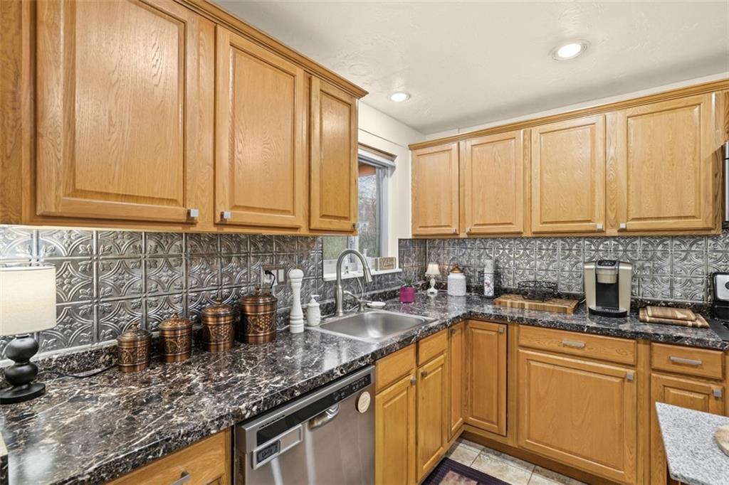 5301 Ranchview Drive Pittsburgh, PA 15236 - Photo 18 of 44 a kitchen with stainless steel appliances granite countertop a sink a stove and cabinets