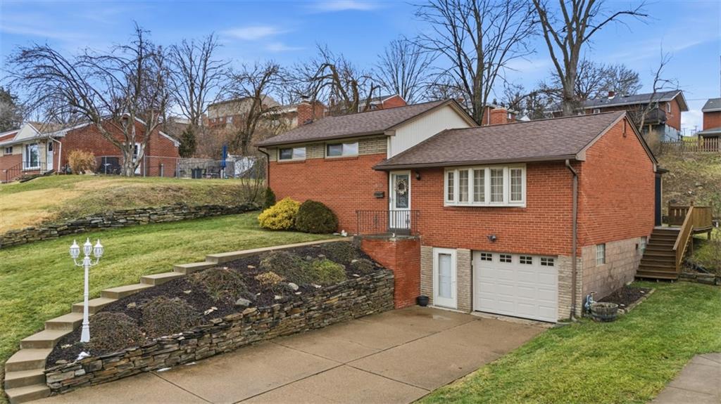 5301 Ranchview Drive Pittsburgh, PA 15236 - Photo 2 of 44 a front view of a house with garden