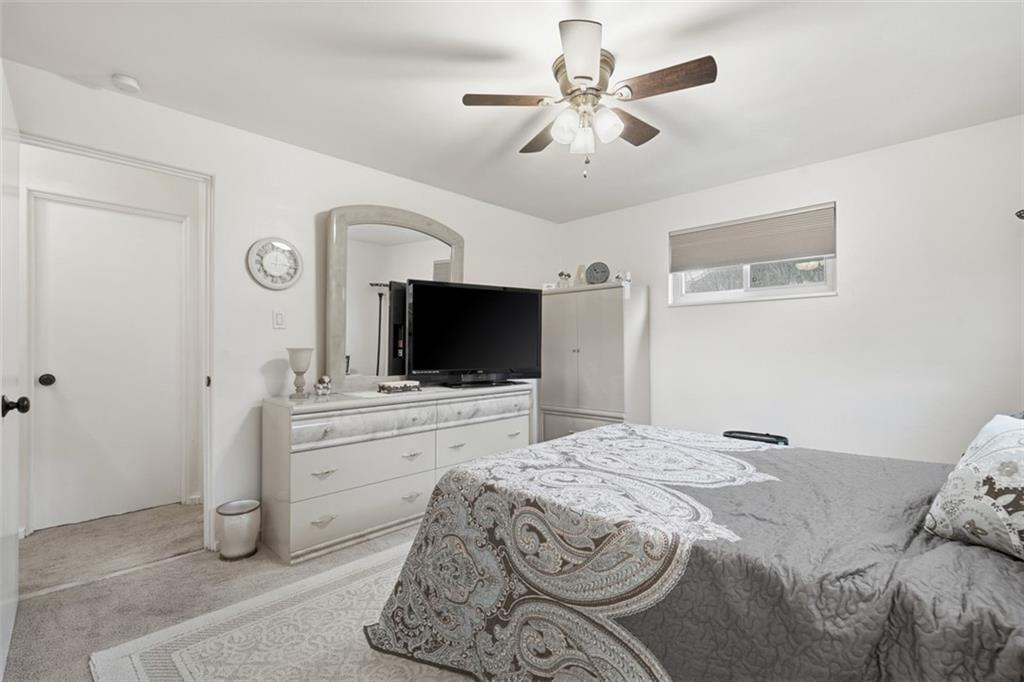 5301 Ranchview Drive Pittsburgh, PA 15236 - Photo 29 of 44 a bedroom with a bed and a flat screen tv