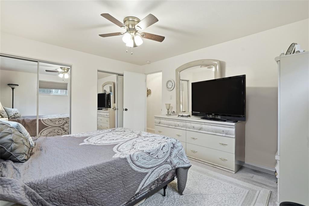 5301 Ranchview Drive Pittsburgh, PA 15236 - Photo 30 of 44 a bedroom with a bed and a flat screen tv