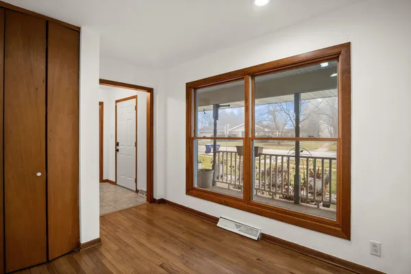 a view of front door with wooden floor