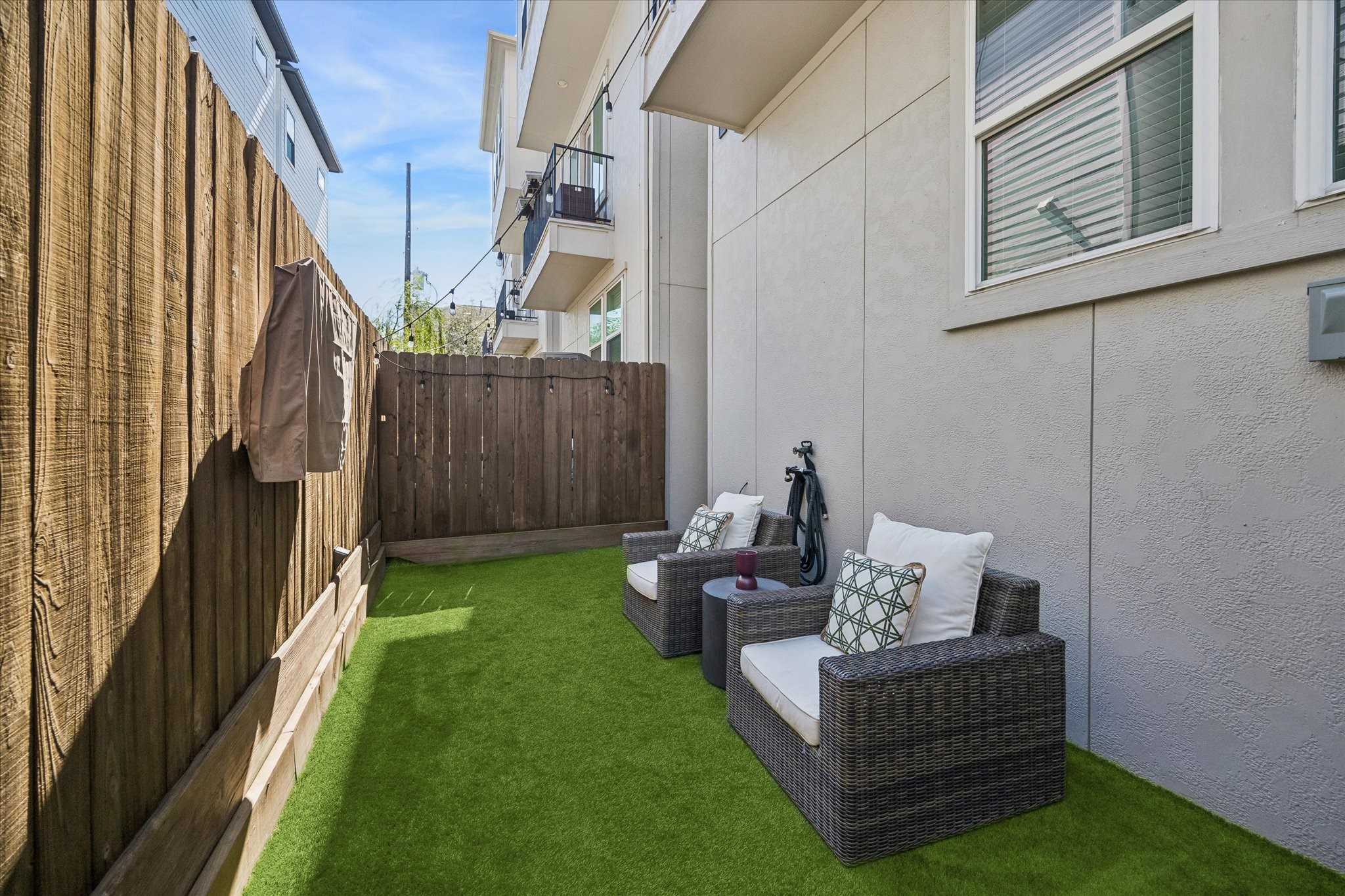 1309 West 24th Street, Unit B Houston, TX 77008 - Photo 21 of 22 Relax on your turfed backyard with television. Great for grilling, enjoying morning coffee or for your furry friends.