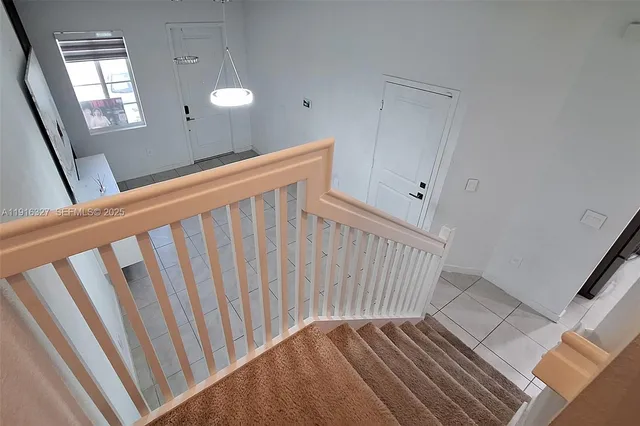 an empty room with closet and windows