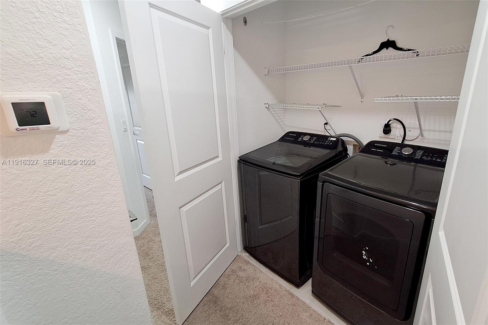1325 Northwest 208th Street Miami Gardens, FL 33169 - Photo 20 of 38 a view of a storage and utility room with racks on the wall