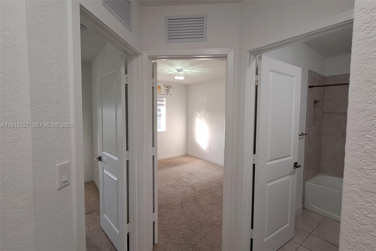 1325 Northwest 208th Street Miami Gardens, FL 33169 - Photo 21 of 38 a view of a hallway to rooms