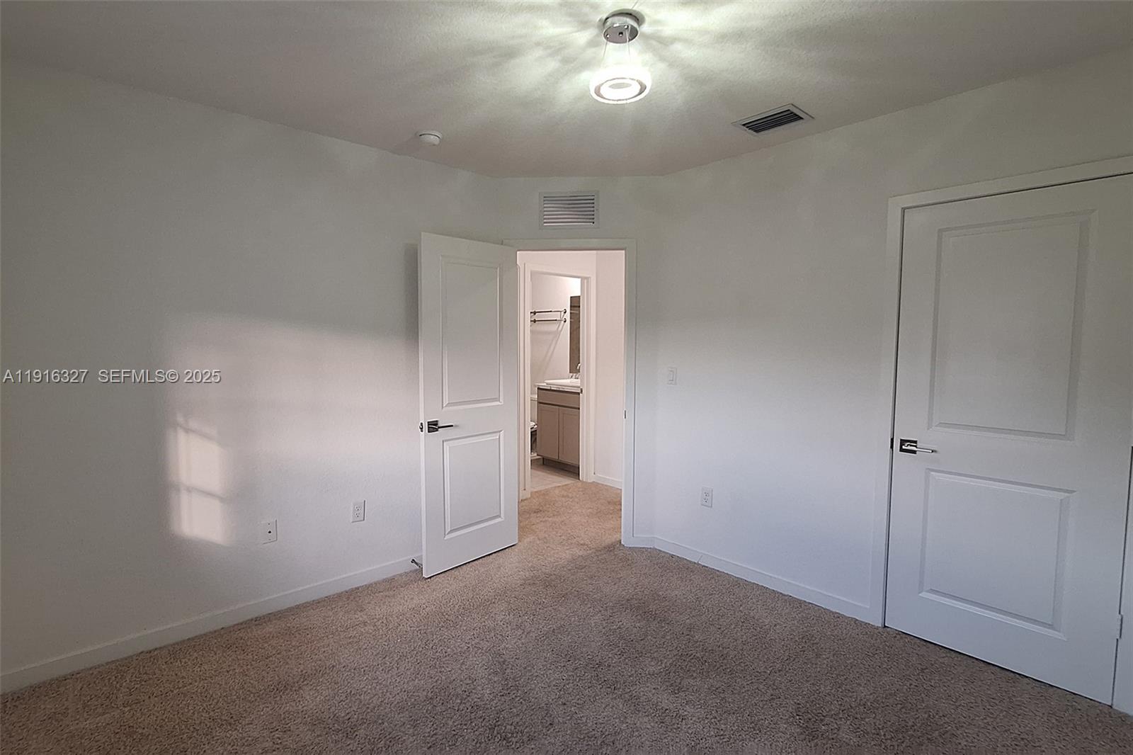 1325 Northwest 208th Street Miami Gardens, FL 33169 - Photo 23 of 38 an empty room with a bathroom