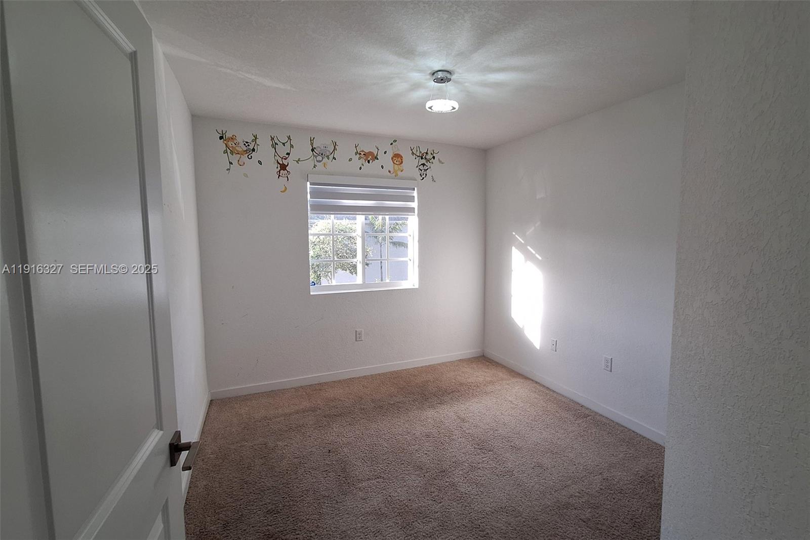 1325 Northwest 208th Street Miami Gardens, FL 33169 - Photo 24 of 38 a view of an empty room with a window