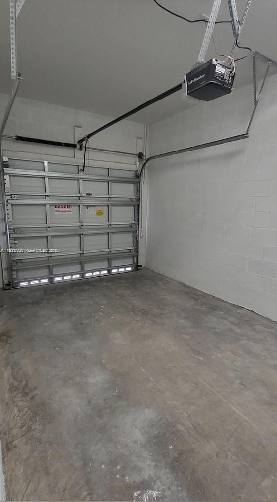 1325 Northwest 208th Street Miami Gardens, FL 33169 - Photo 26 of 38 a view of a room with racks on the wall