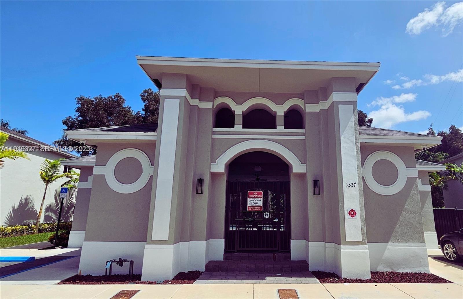 1325 Northwest 208th Street Miami Gardens, FL 33169 - Photo 33 of 38 a front view of a house with entryway