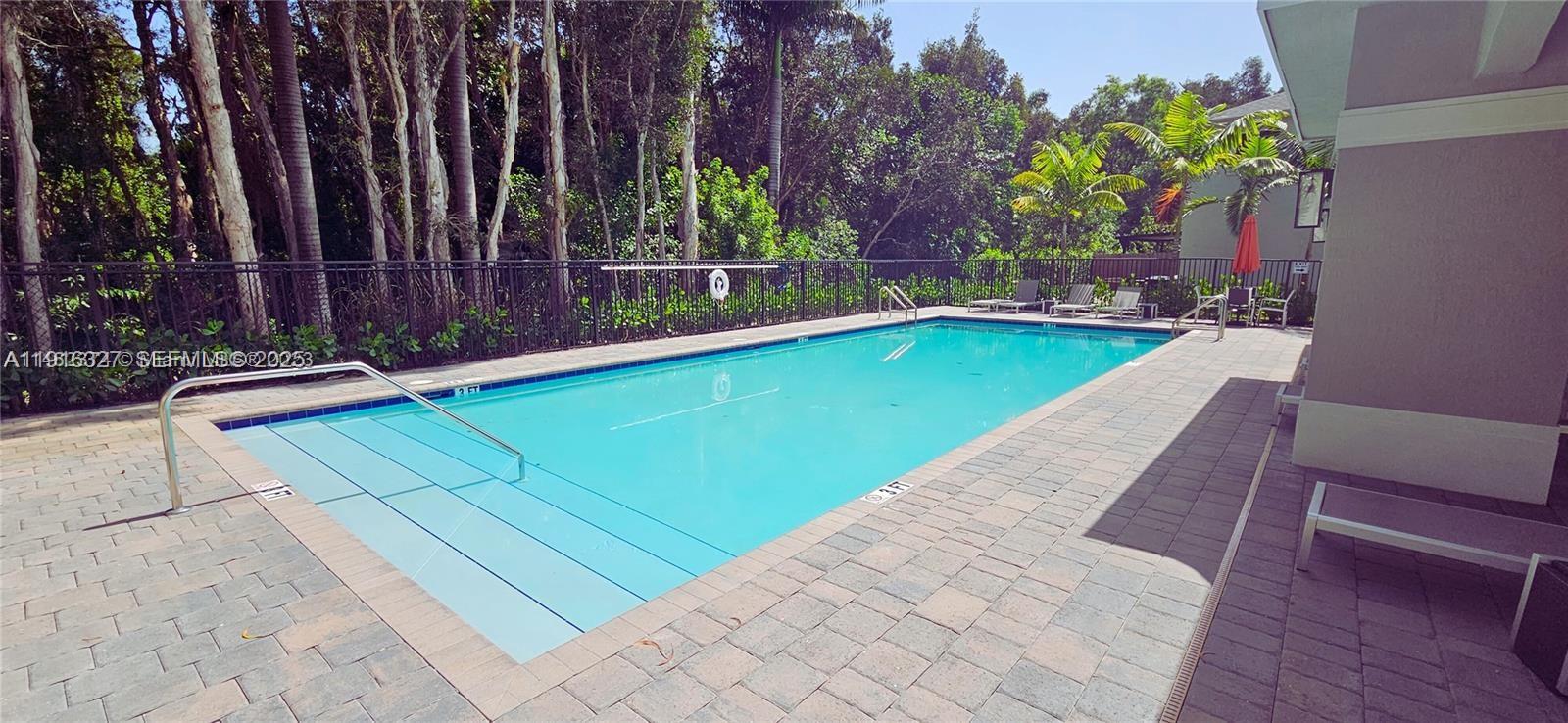 1325 Northwest 208th Street Miami Gardens, FL 33169 - Photo 35 of 38 a view of a backyard with swimming pool