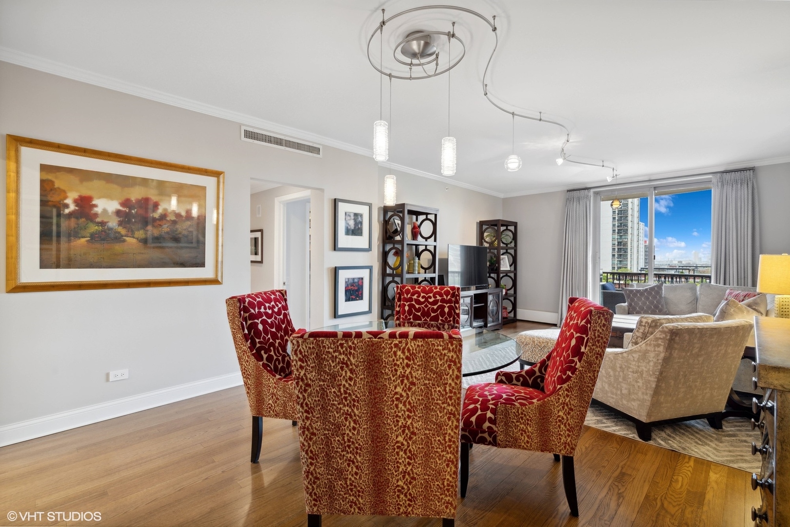 1301 North Dearborn Street, Unit 705 Chicago, IL 60610 - Photo 11 of 25 a living room with furniture a window and a clock