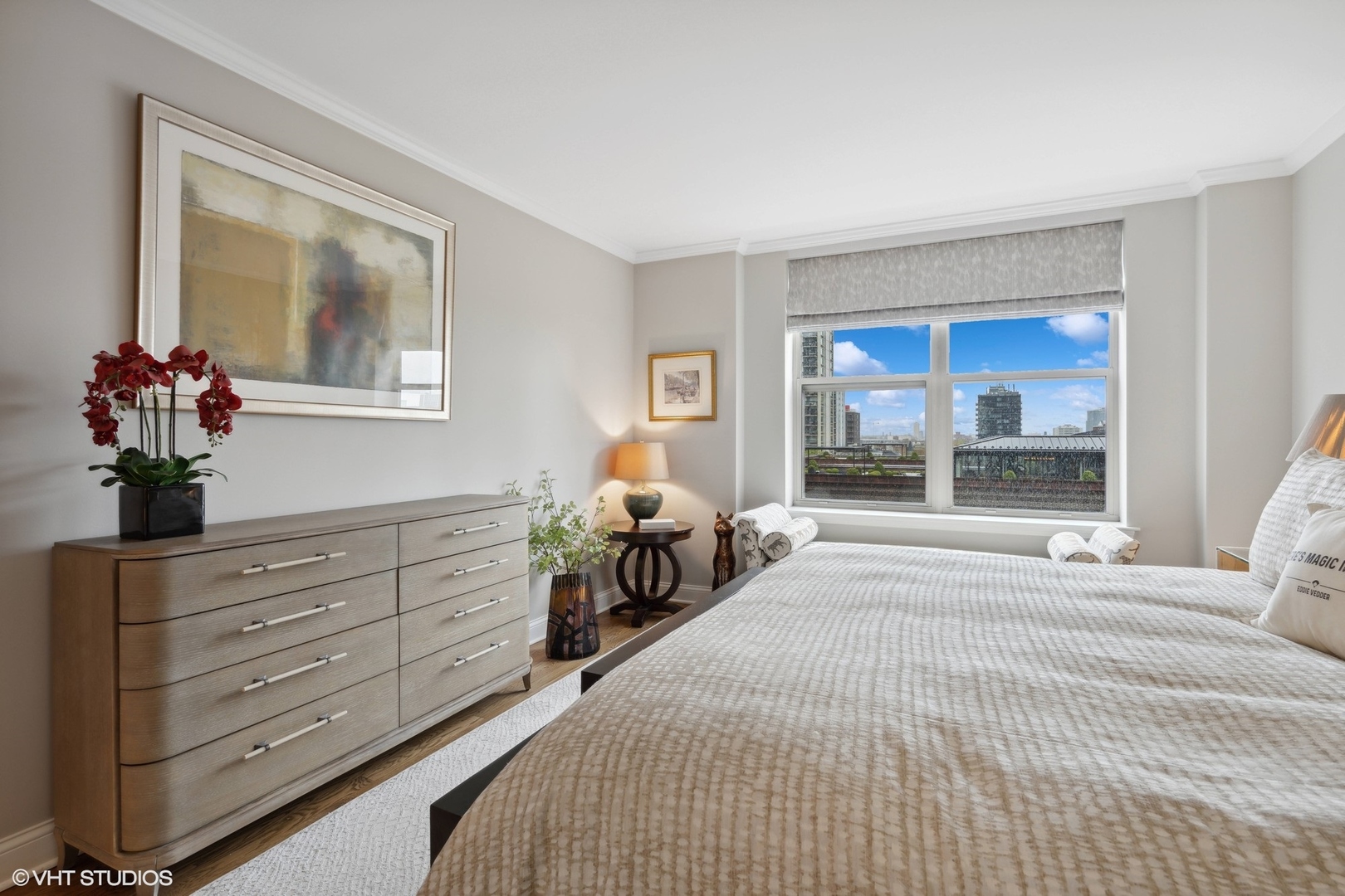 1301 North Dearborn Street, Unit 705 Chicago, IL 60610 - Photo 14 of 25 a bedroom with a bed and a large mirror
