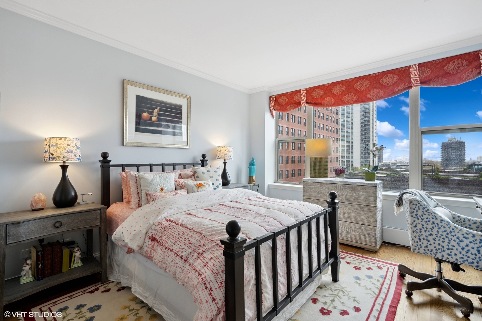 1301 North Dearborn Street, Unit 705 Chicago, IL 60610 - Photo 18 of 25 a bedroom with a bed a table and chair