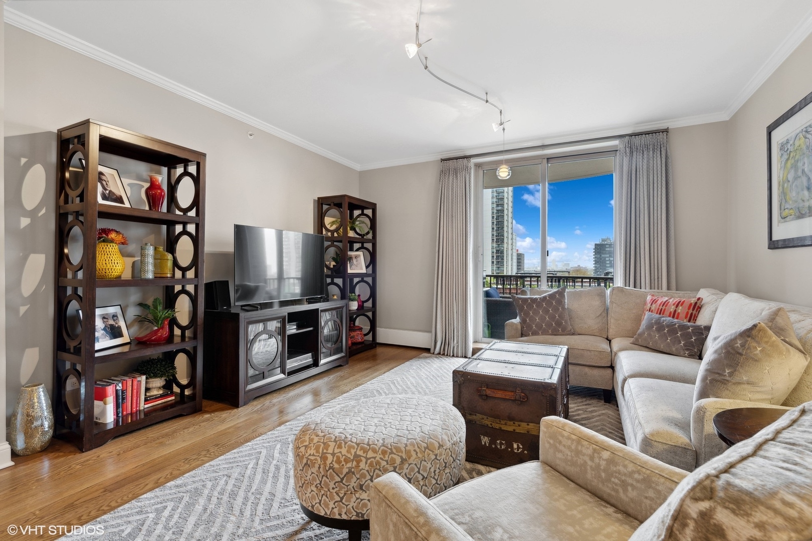 1301 North Dearborn Street, Unit 705 Chicago, IL 60610 - Photo 6 of 25 a living room with furniture and a flat screen tv