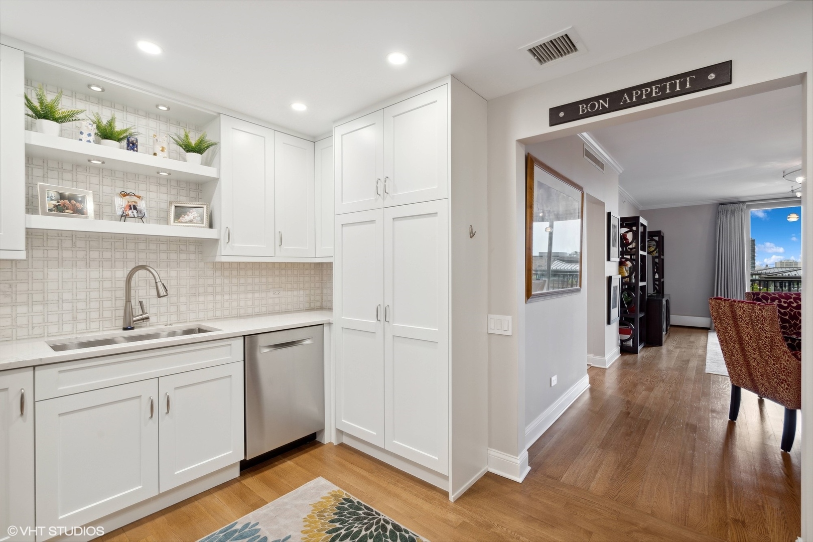 1301 North Dearborn Street, Unit 705 Chicago, IL 60610 - Photo 9 of 25 a kitchen with a sink appliances and cabinets