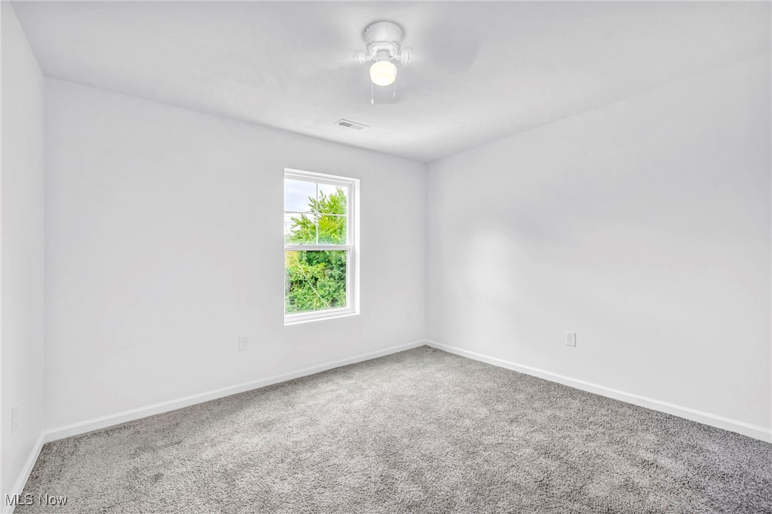 3709 Sudbury Road Cleveland, OH 44120 - Photo 21 of 29 Unfurnished room featuring ceiling fan and carpet floors