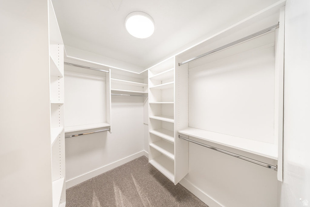 2169 Orchard Pines Loop East Bountiful, UT 84010 - Photo 11 of 32 Walk-in closet featuring white built-in shelving, multiple hanging rods, and recessed lighting