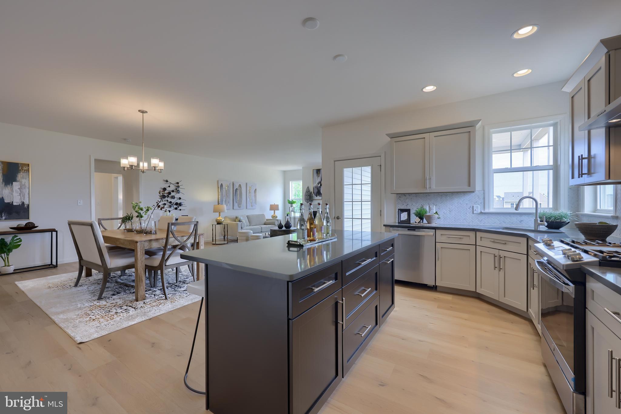 361 Autumn Harvest Lane, Unit 2 Lititz, PA 17543 - Photo 15 of 50 a kitchen with lots of counter top space and dining table