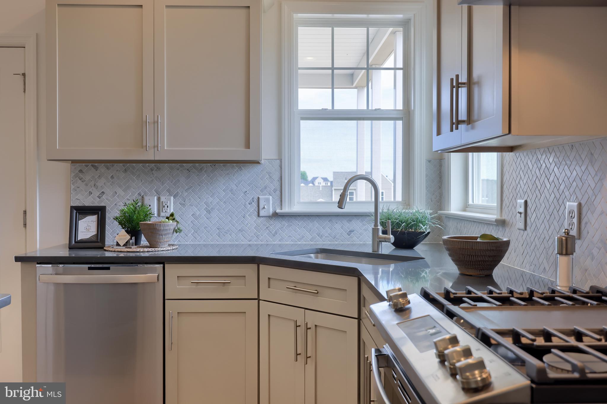 361 Autumn Harvest Lane, Unit 2 Lititz, PA 17543 - Photo 20 of 50 a kitchen with stainless steel appliances granite countertop a stove and a sink