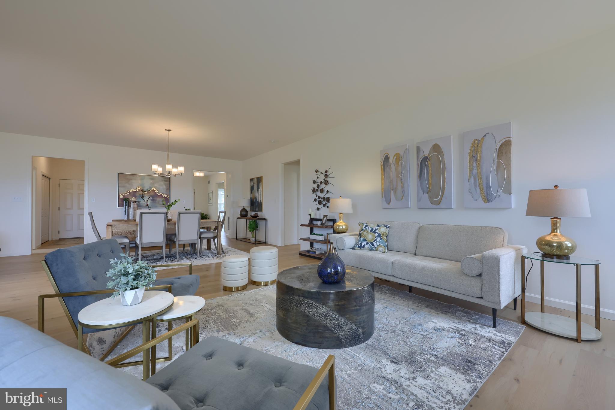 361 Autumn Harvest Lane, Unit 2 Lititz, PA 17543 - Photo 27 of 50 a living room with furniture and a table