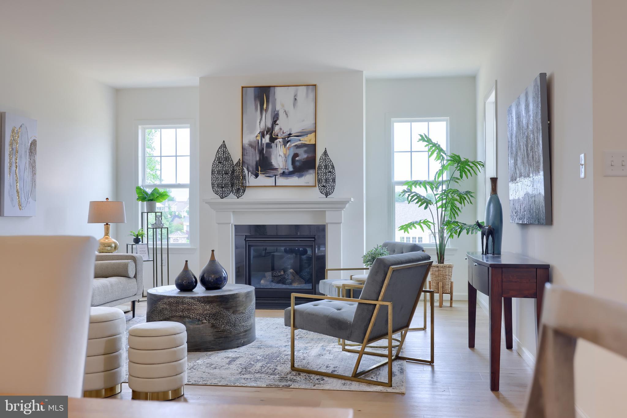 361 Autumn Harvest Lane, Unit 2 Lititz, PA 17543 - Photo 31 of 50 a living room with furniture and a fireplace