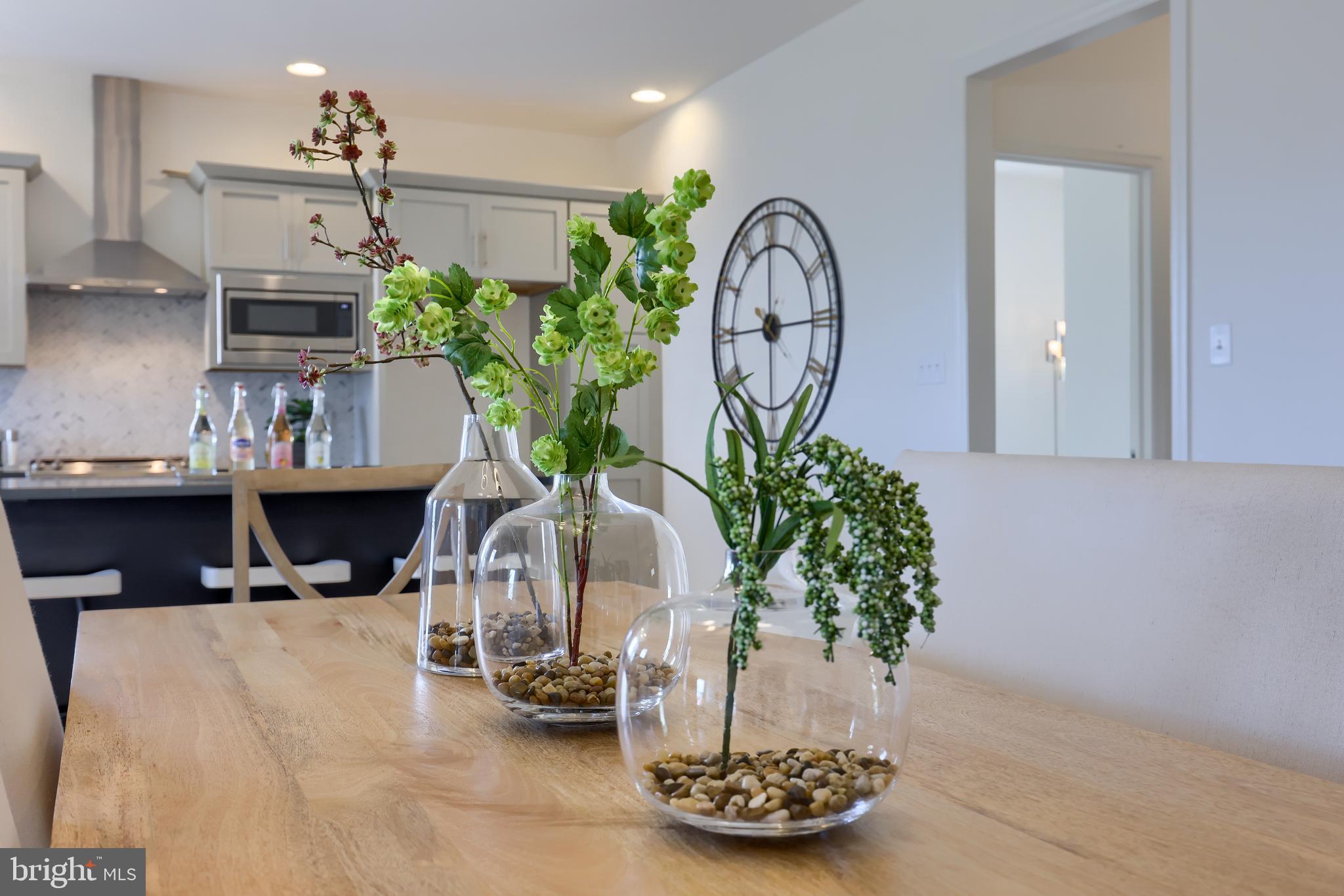 361 Autumn Harvest Lane, Unit 2 Lititz, PA 17543 - Photo 33 of 50 a vase of flowers sitting on a table