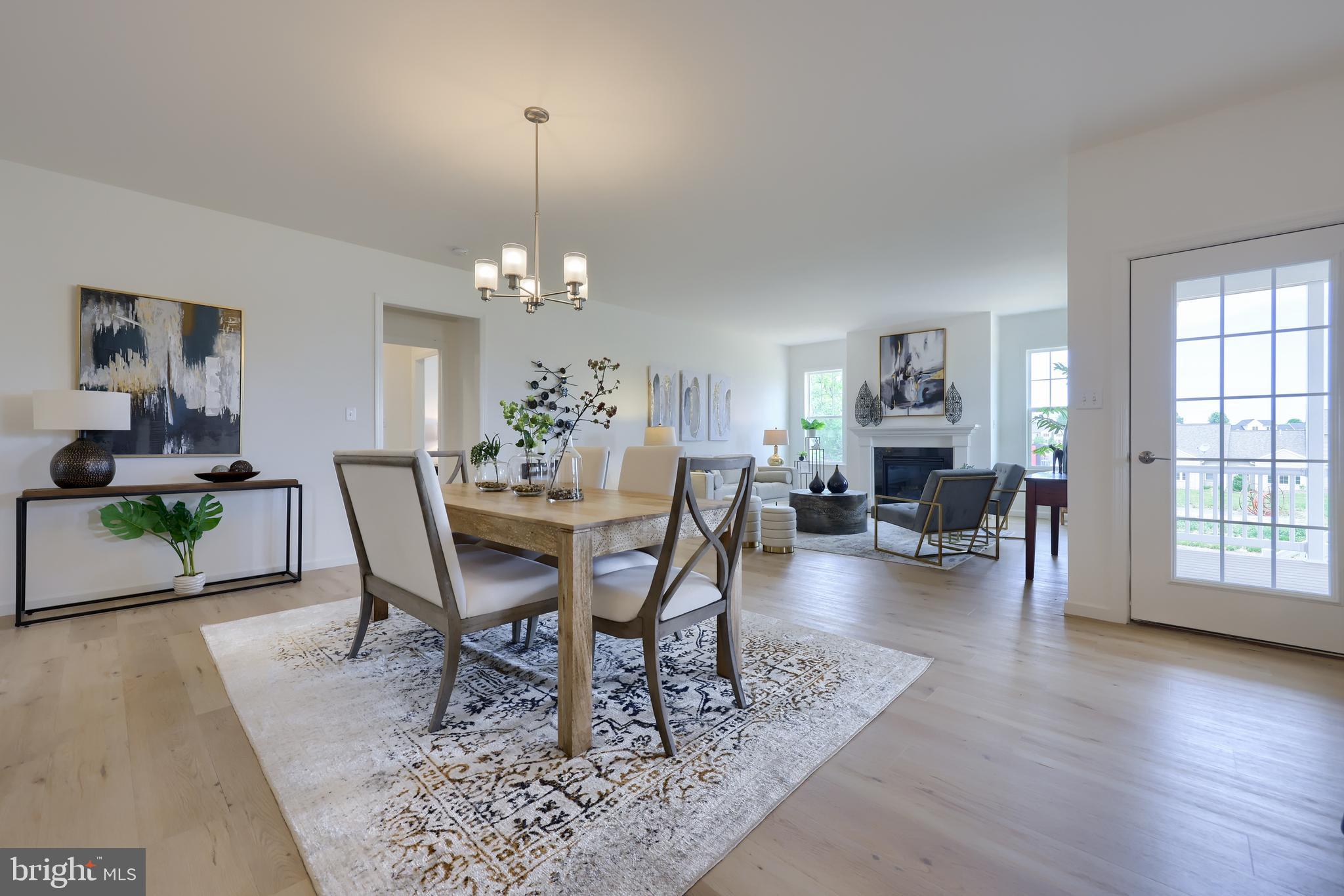 361 Autumn Harvest Lane, Unit 2 Lititz, PA 17543 - Photo 35 of 50 a view of a dining room with furniture and wooden floor