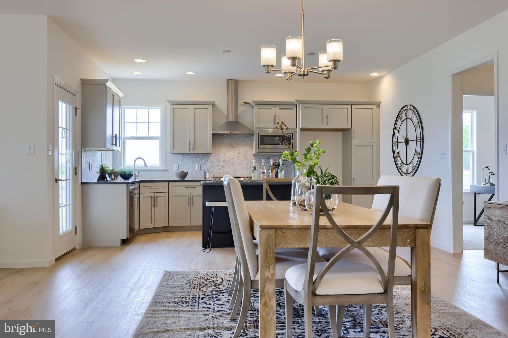 361 Autumn Harvest Lane, Unit 2 Lititz, PA 17543 - Photo 36 of 50 a view of a dining room with furniture and wooden floor