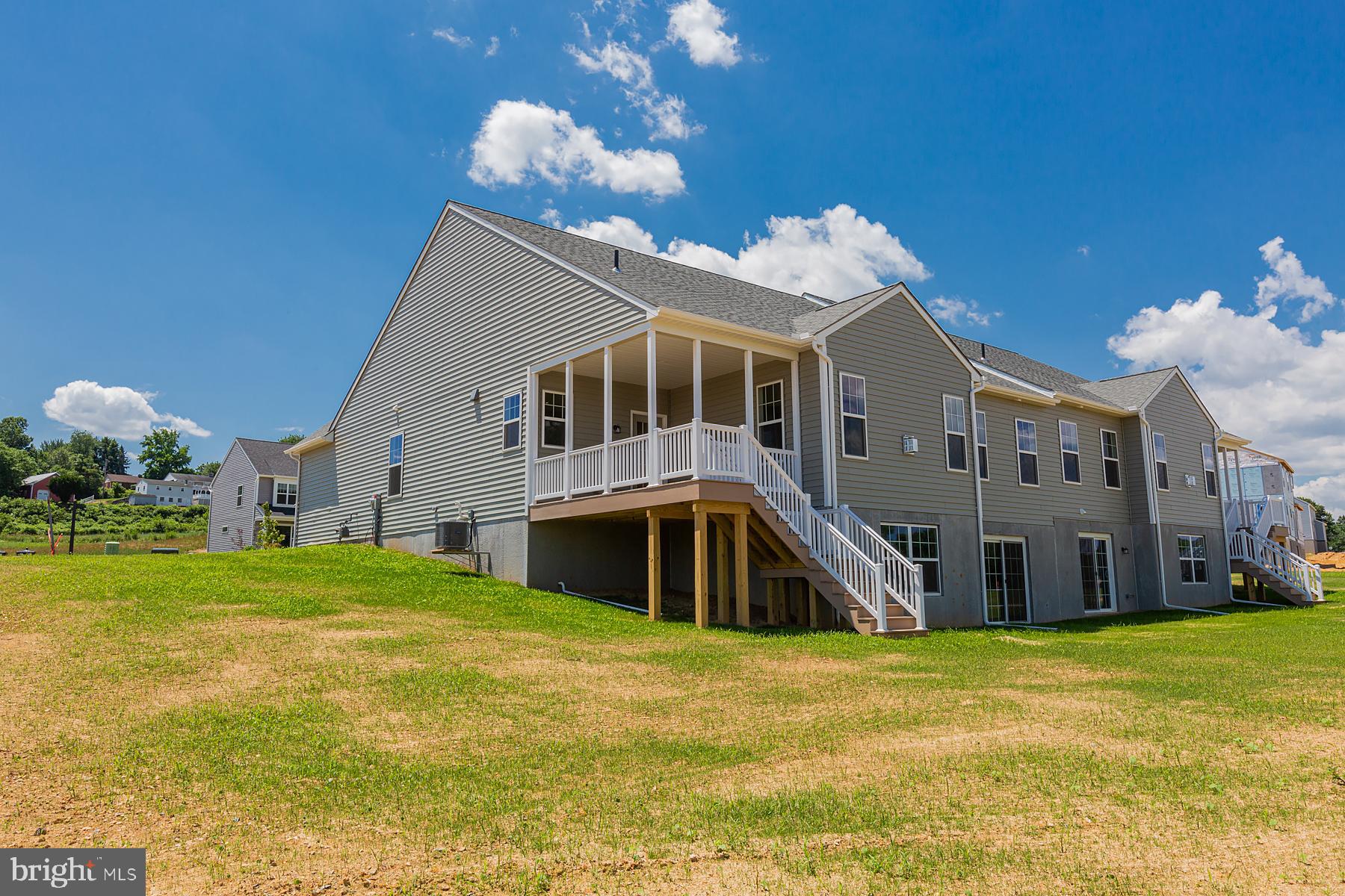 361 Autumn Harvest Lane, Unit 2 Lititz, PA 17543 - Photo 10 of 50 a front view of a house with a big yard