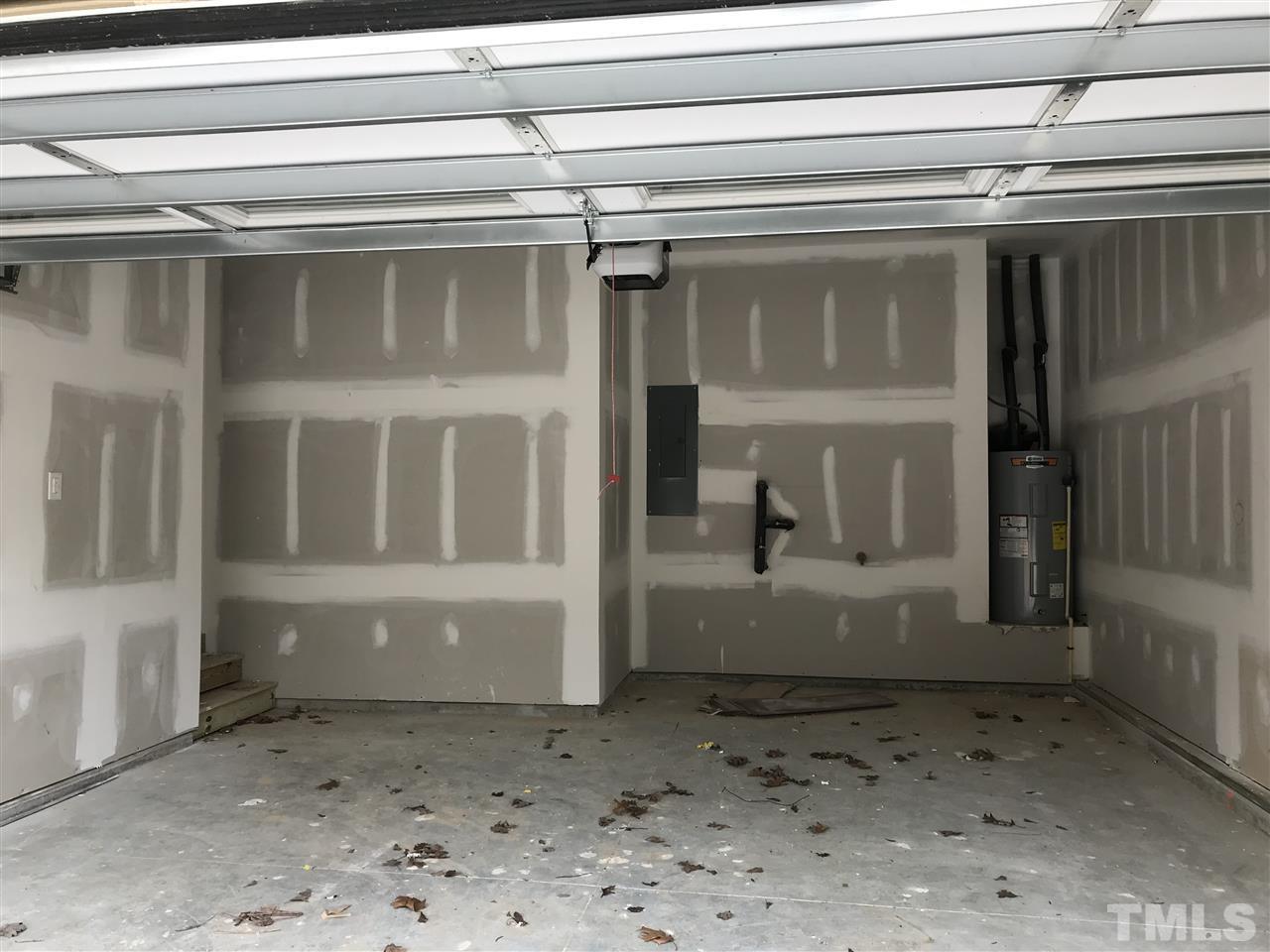 2528 Rambling Creek Road, Unit 22 Apex, NC 27523 - Photo 22 of 28 Garage with extra storage area in the back.