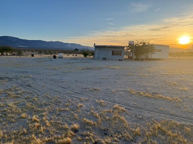3 Foothill Road Lucerne Valley, CA 92356 - Photo 6 of 14 a view of a dry yard with wooden fence