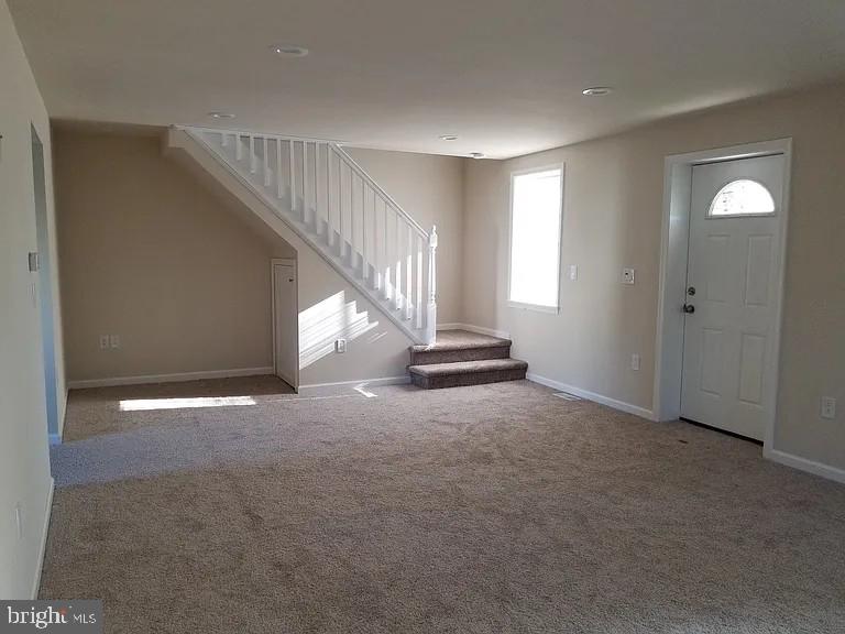 599 Cherry Road Souderton, PA 18964 - Photo 12 of 13 a view of an empty room with stairs and a window