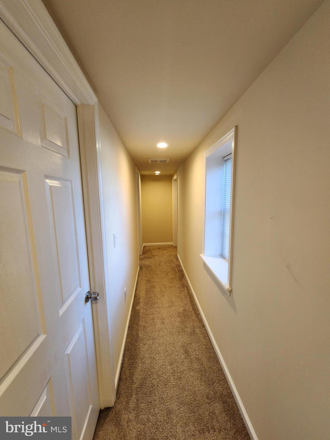 599 Cherry Road Souderton, PA 18964 - Photo 2 of 13 a view of a hallway with wooden floor and staircase