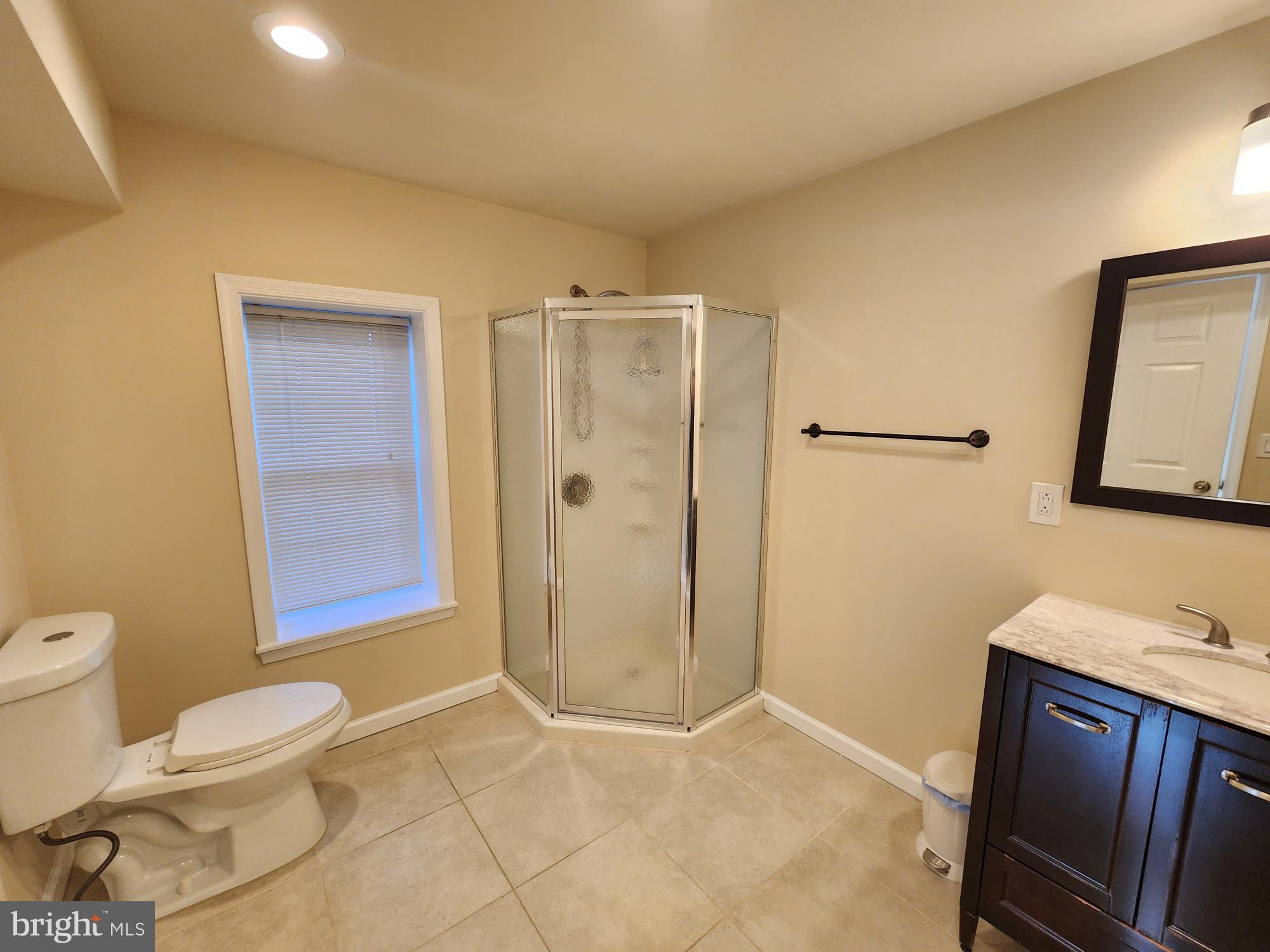 599 Cherry Road Souderton, PA 18964 - Photo 9 of 13 a bathroom with a granite countertop sink a toilet and shower