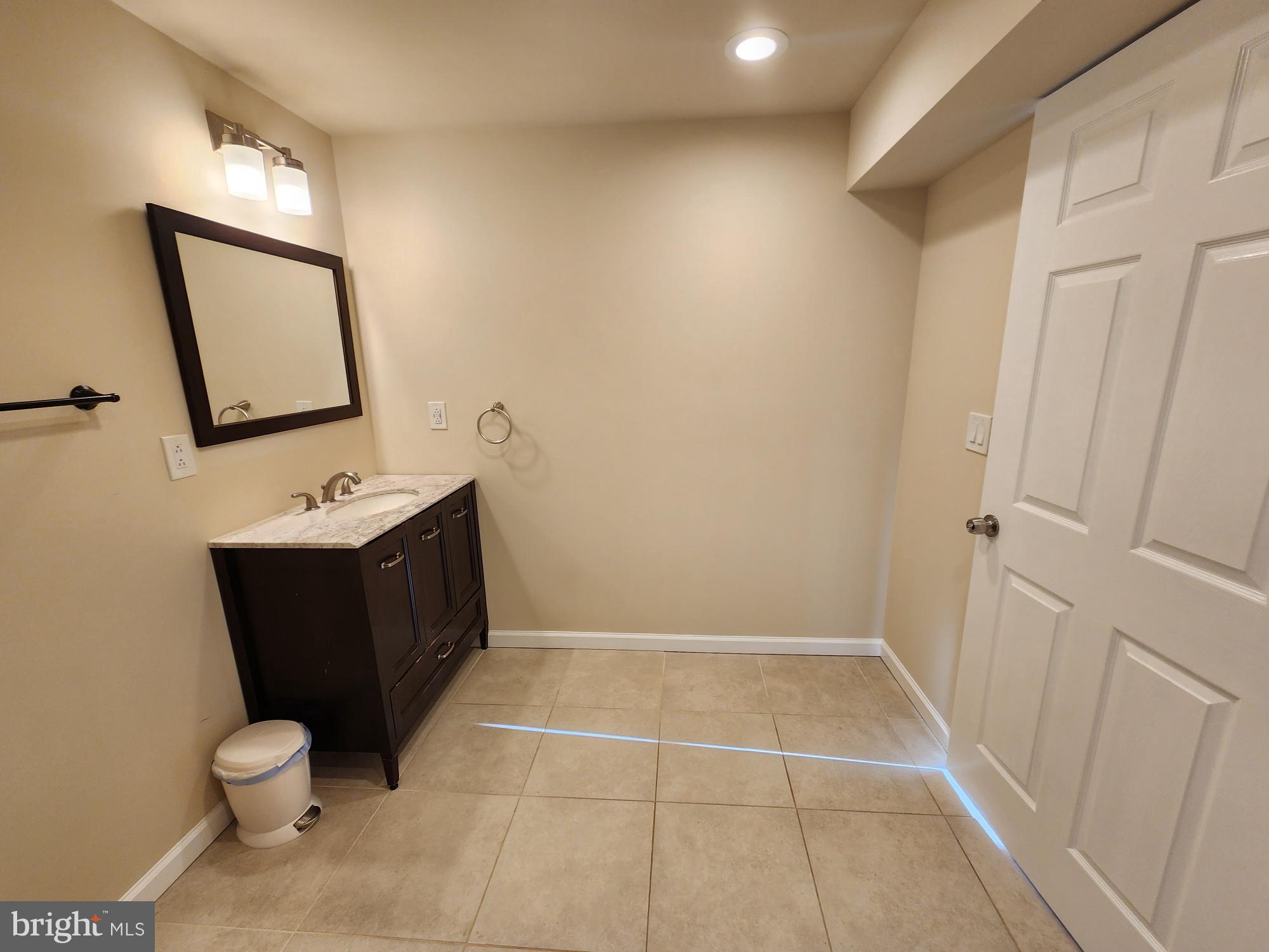 599 Cherry Road Souderton, PA 18964 - Photo 10 of 13 a bathroom with a toilet sink and mirror