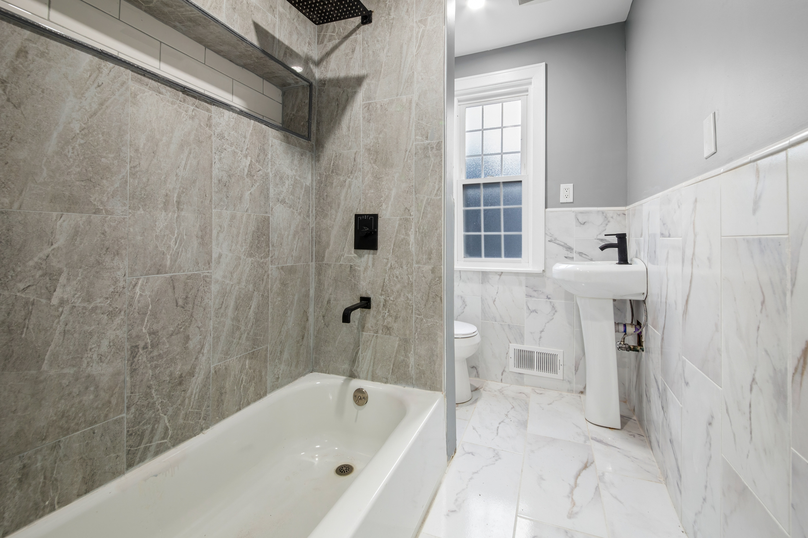 4251 North Lawndale Avenue, Unit 2 Chicago, IL 60618 - Photo 17 of 20 a bathroom with a bathtub and a shower