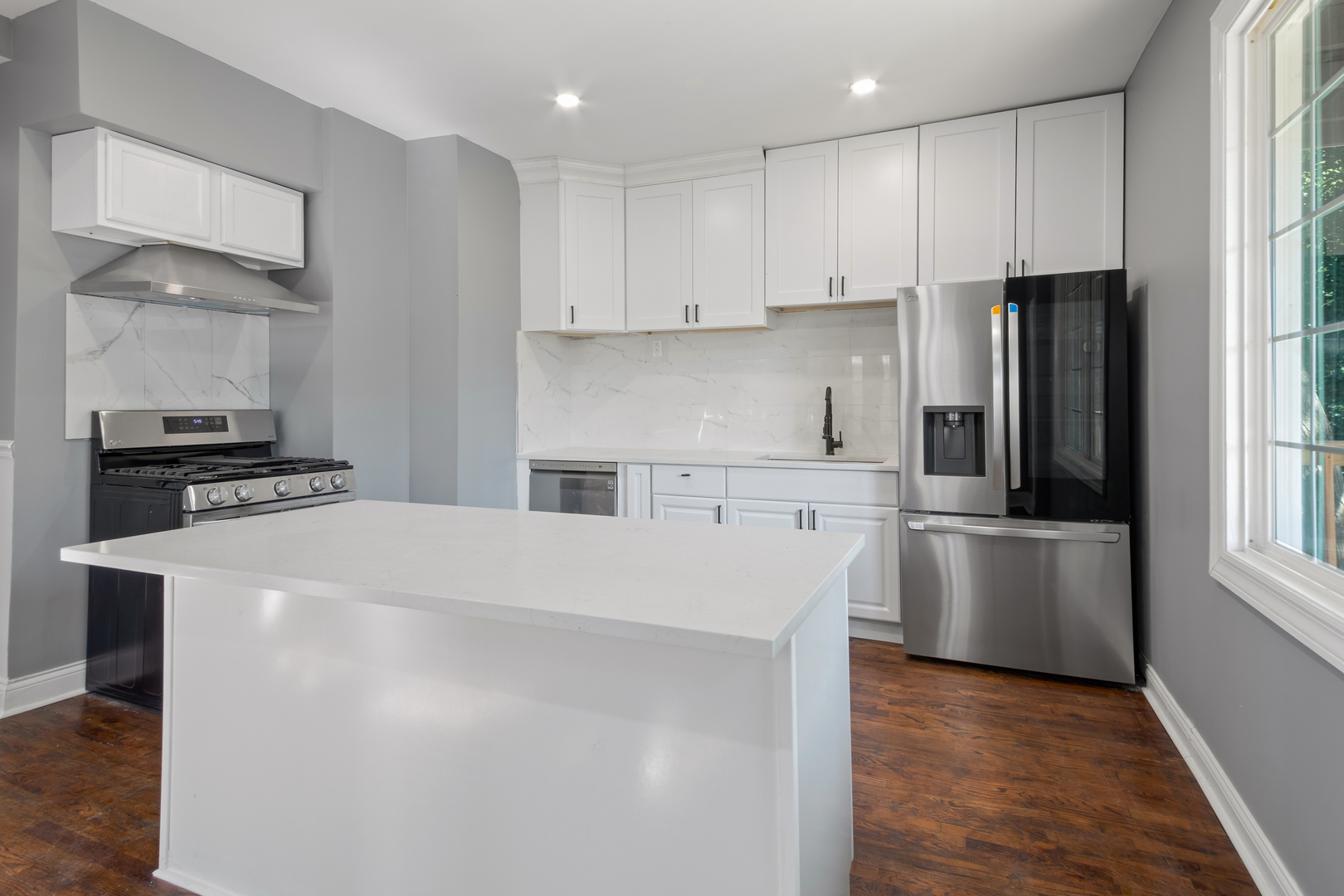 4251 North Lawndale Avenue, Unit 2 Chicago, IL 60618 - Photo 6 of 20 a kitchen with stainless steel appliances a refrigerator and a stove top oven