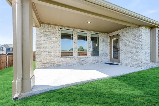 a view of front door of house with yard