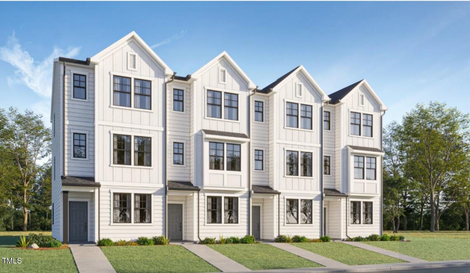 1502 Crescent Townes Way Raleigh, NC 27604 - Photo 1 of 25 a view of a big yard in front of a brick building