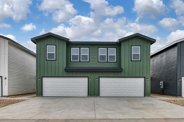 a front view of a house with yard