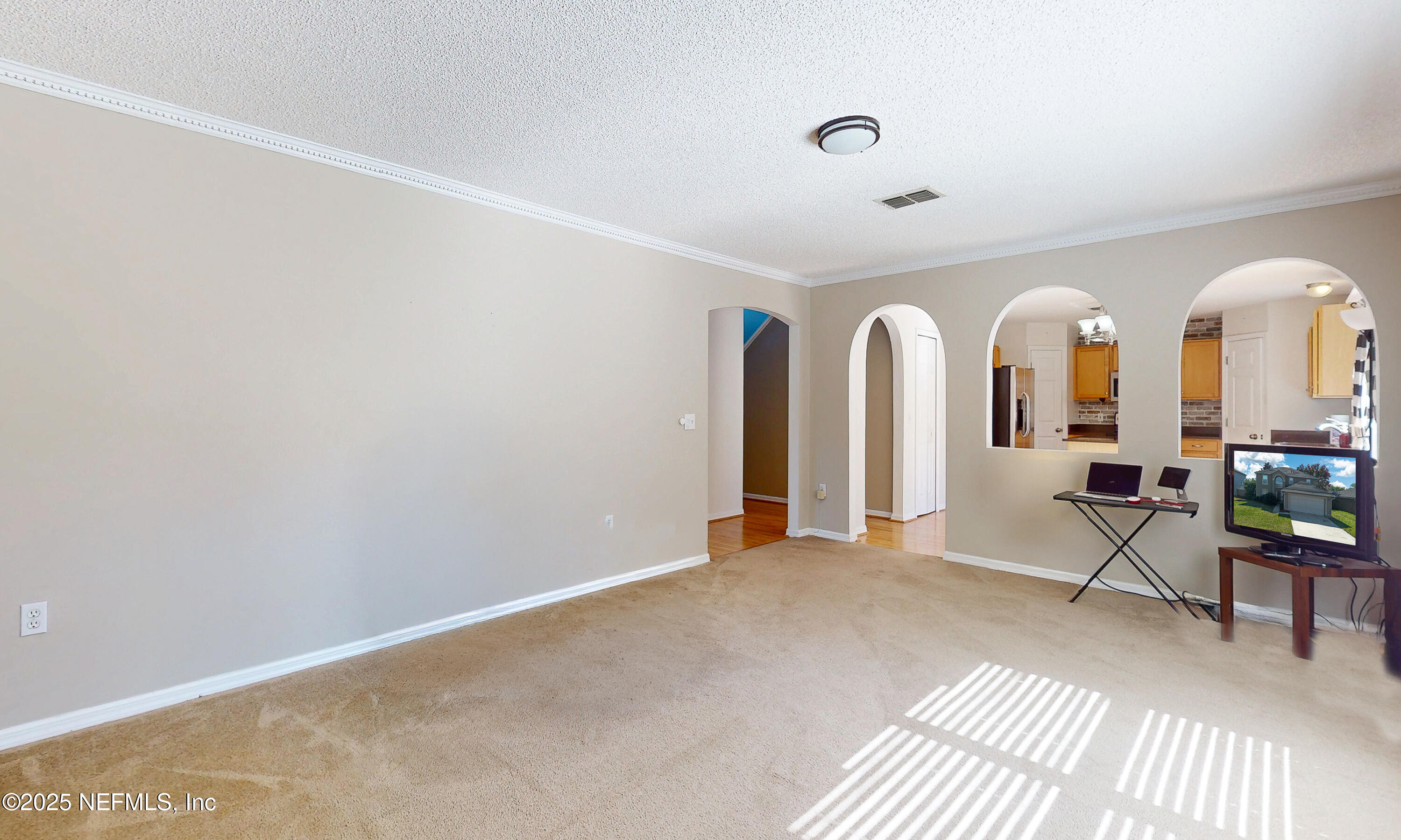 3031 Valkyrie Road Middleburg, FL 32068 - Photo 10 of 36 a view of a livingroom with wooden floor and furniture