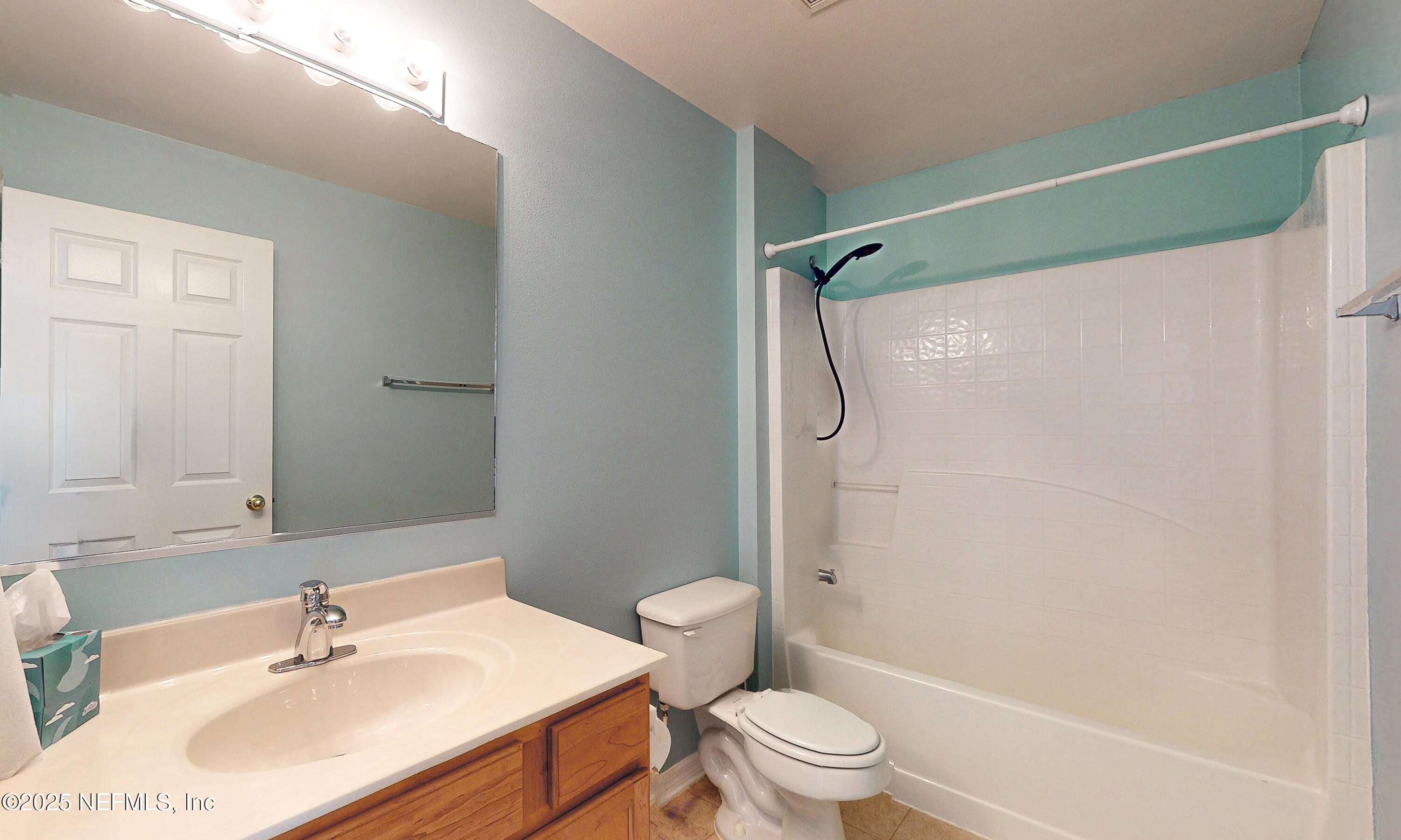 3031 Valkyrie Road Middleburg, FL 32068 - Photo 14 of 36 a bathroom with a sink toilet and shower