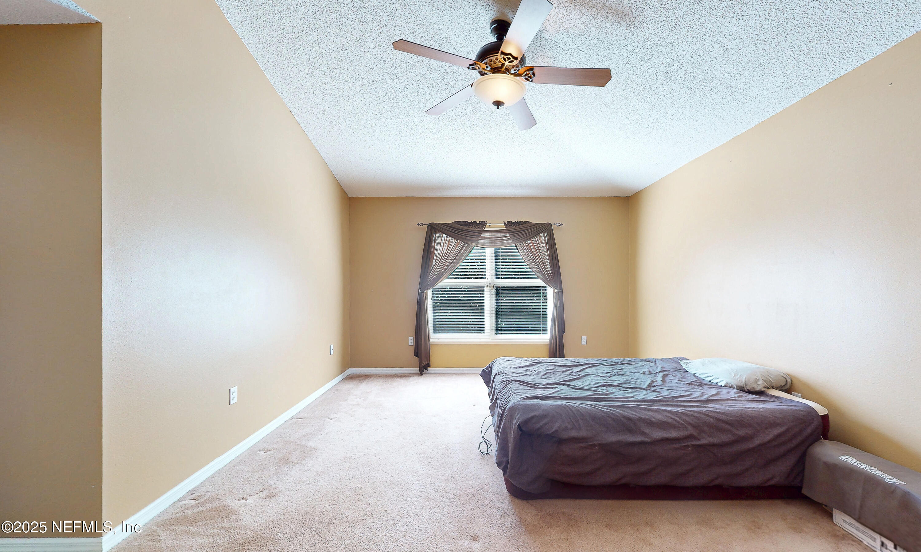 3031 Valkyrie Road Middleburg, FL 32068 - Photo 24 of 36 a bedroom with a bed and a large window