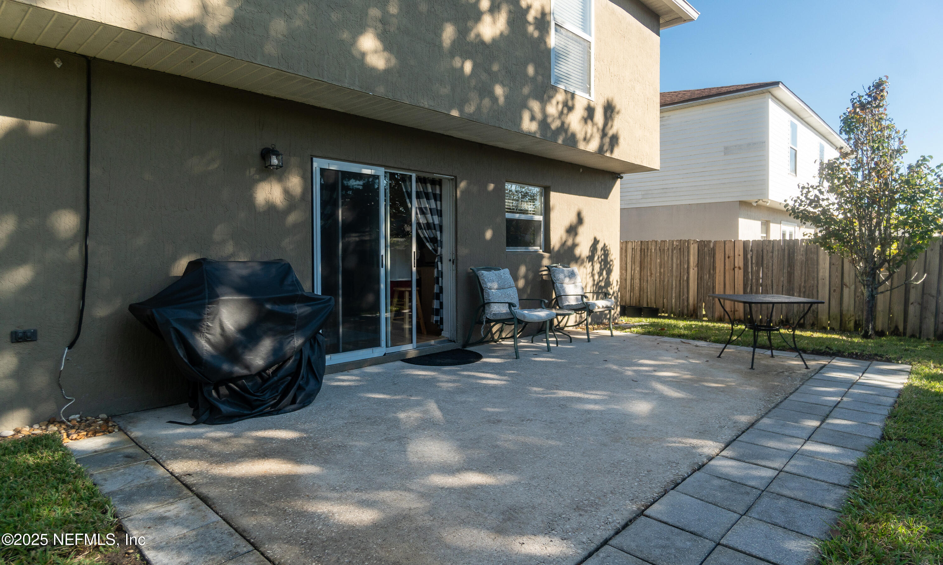 3031 Valkyrie Road Middleburg, FL 32068 - Photo 33 of 36 a view of a chairs and table in backyard of the house