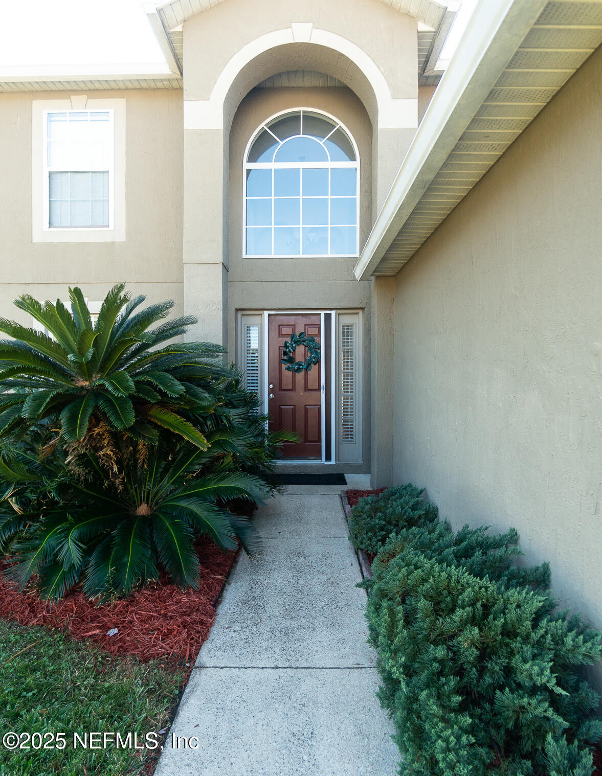 3031 Valkyrie Road Middleburg, FL 32068 - Photo 4 of 36 a front view of a house with a yard