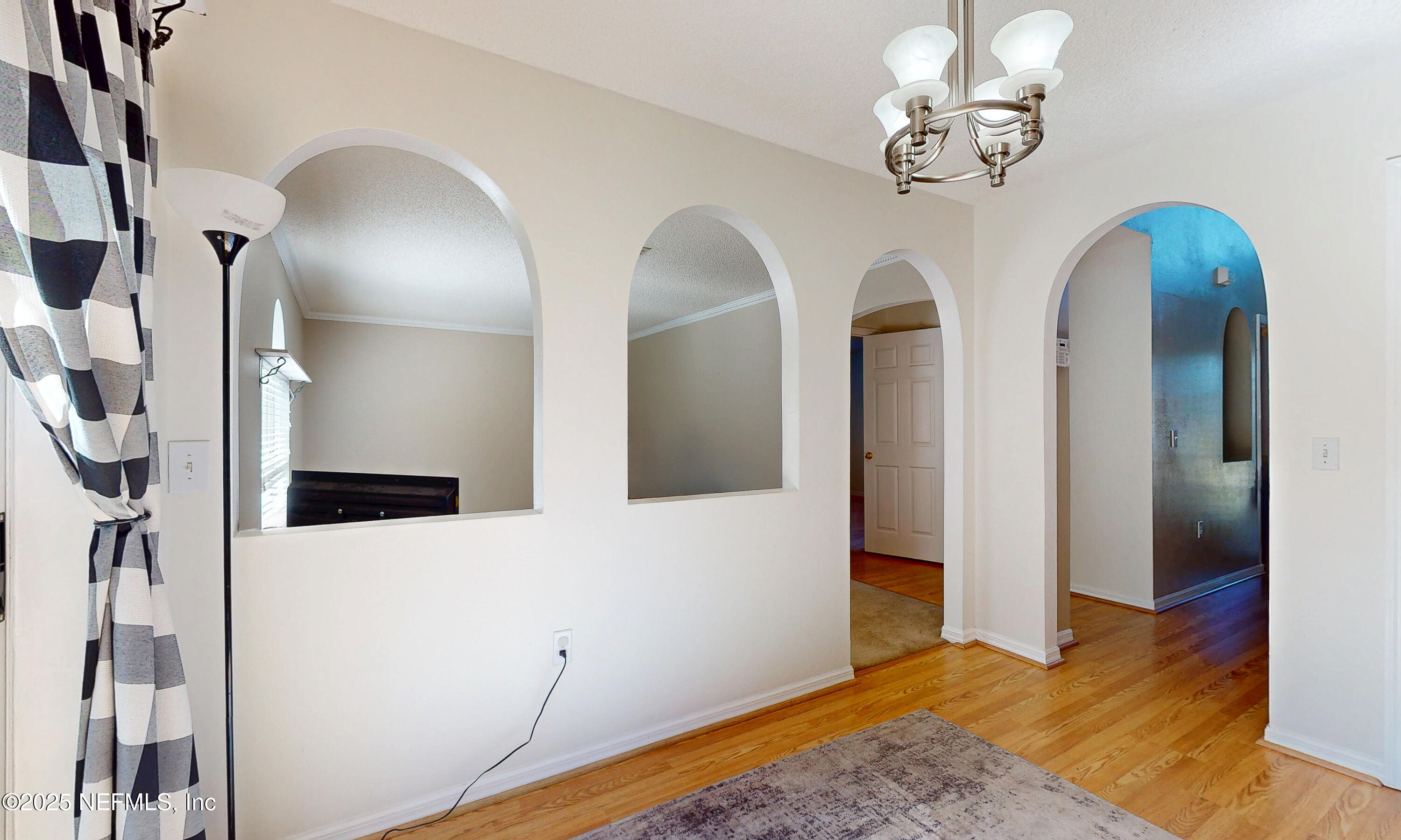 3031 Valkyrie Road Middleburg, FL 32068 - Photo 8 of 36 a view of a livingroom with wooden floor and staircase