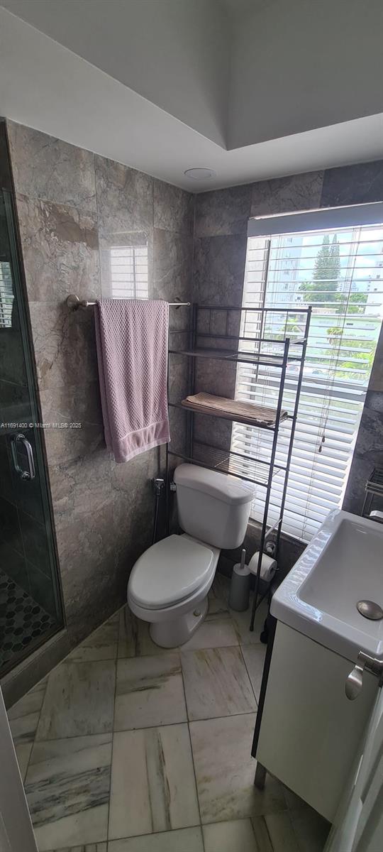 1300 Alton Road, Unit 3D Miami Beach, FL 33139 - Photo 7 of 11 a bathroom with a toilet and a shower